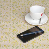 Wipe Clean Fabric. Culla: Yarrow Natural- Pictured with a cup, saucer, phone and pen