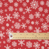 Symphony: Snowflake Wipe Clean Fabric pictured with a wooden ruler