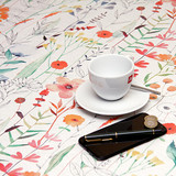 Wipe Clean Tablecloth - Navarra: Villandry.  Pictured with a phone, pen, cup and saucer.