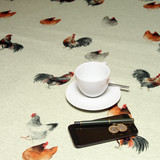 Wipe Clean Tablecloth - Digital Chicken Coop. Pictured with a cup and saucer, 'phone and  pen.