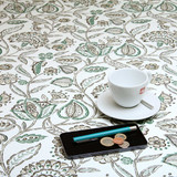 Wipe Clean Tablecloth - Blaze: Lottie. Pictured with a cup and saucer, 'phone, pen and coins.