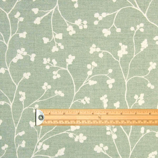 Blaze Sprig Sage Acrylic Coated Wipe Clean Fabric. Pictured with a ruler to show scale.