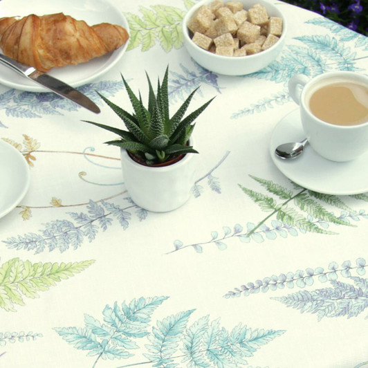 Wipe Clean Tablecloth - Blaze: Fern Multi on a table with plates and cups