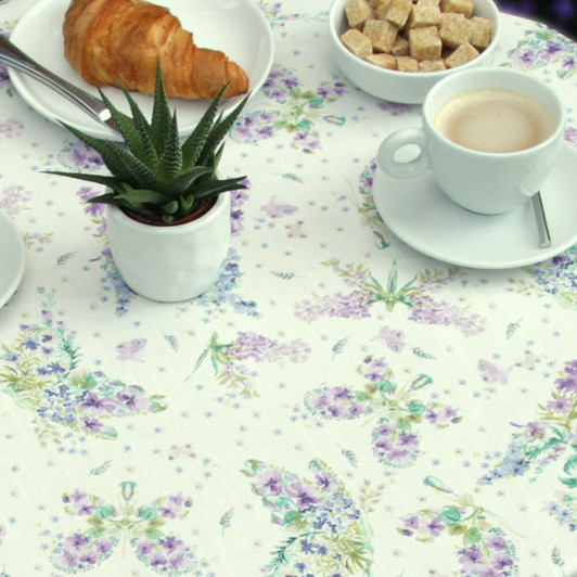 Acrylic Coated Tablecloth Blaze: Floral Butterflies on a table with plates and cups