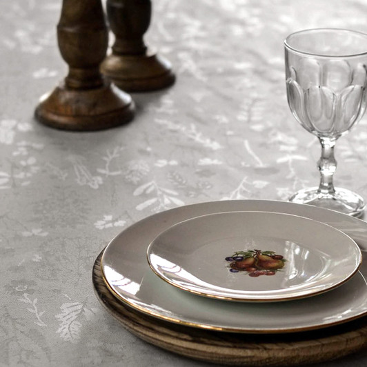 Wipe Clean Tablecloth - Murcia Lorraine Grey - shown with a table setting