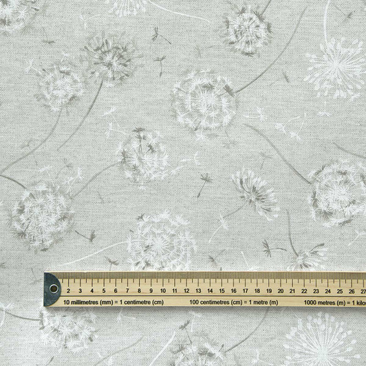 Wipe Clean Tablecloth Fabric. Living: Glam Dandelion - Pictured with a wooden ruler