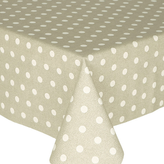 Loneta Polka - Cream. Wipe Clean Fabric pictured on a table.