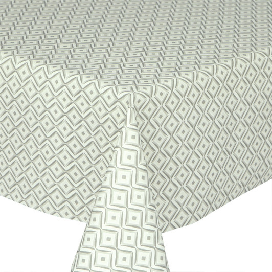 Navarra: Jewel.  Wipe Clean Tablecloth, pictured on the corner of a table.