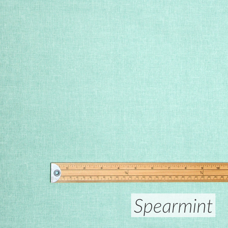 Living Weave fabric in Spearrmint. Pictured with a wooden ruler to show scale