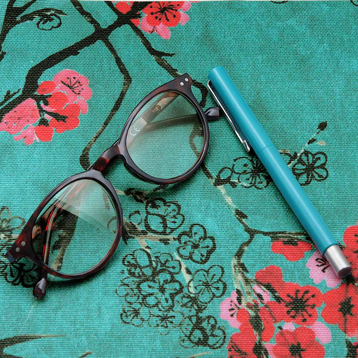 Digital Beijing - Wipe clean acrylic coated tablecloth - pictured with a pair of glasses and a pen