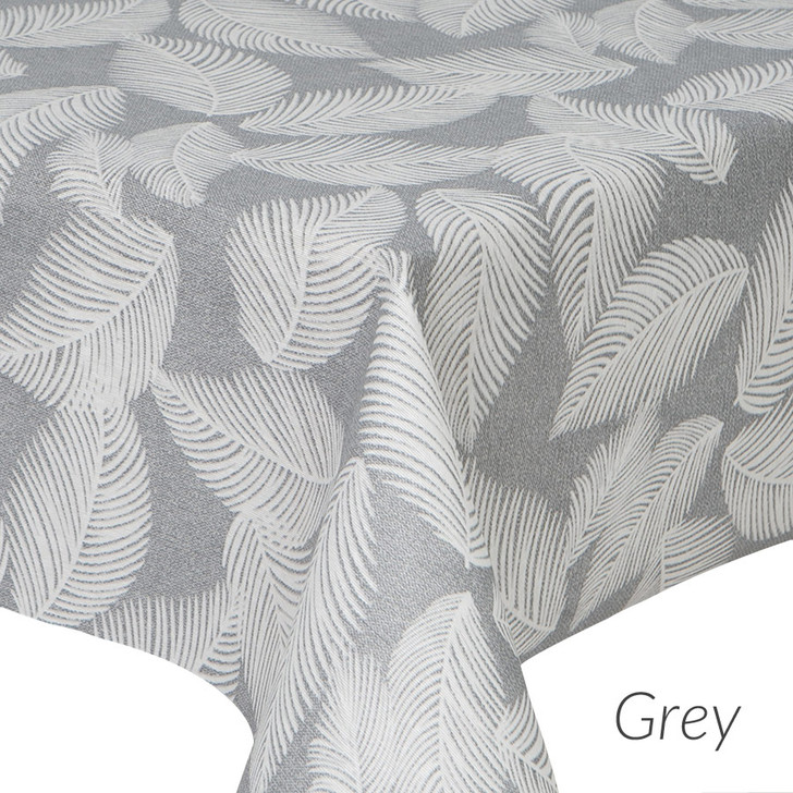 Wipe clean tablecloth. Living Feathers - Grey. Pictured on a table.