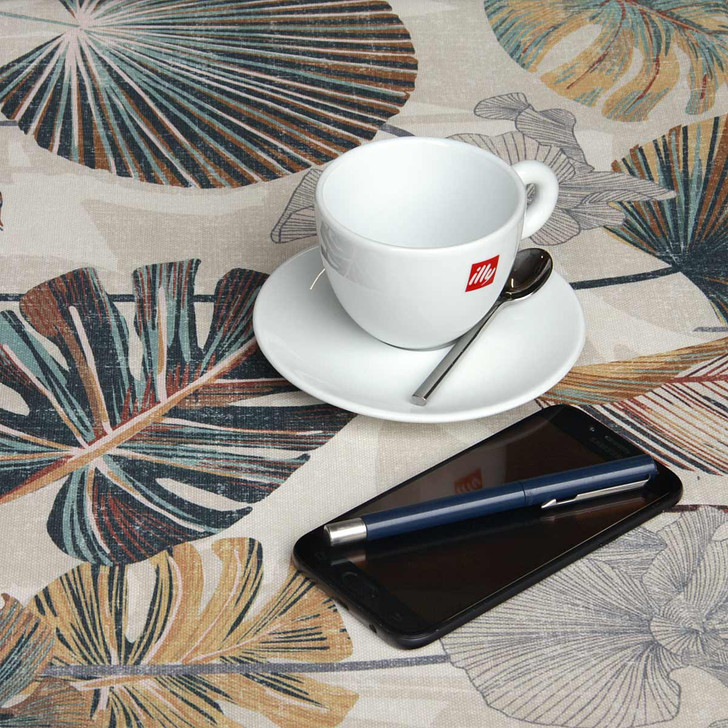 Wipe Clean Tablecloth - Digital: Kalani - Russet.  Pictured with a cup and saucer, 'phone, pen and coins.