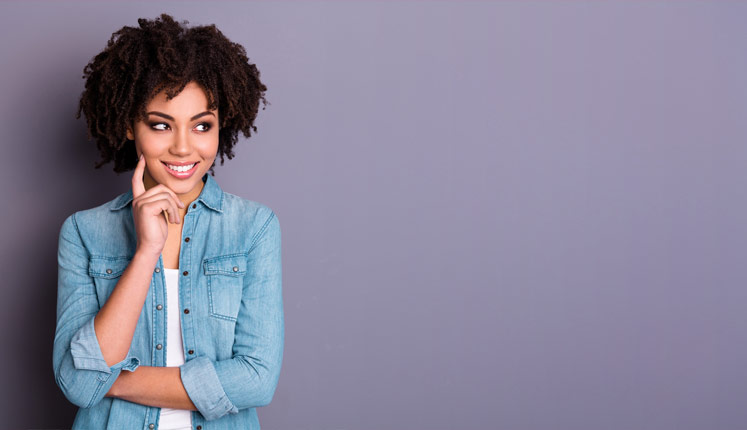 A pretty young girl looking pleased to have found Extra-Wide Wipe Clean Tablecloths