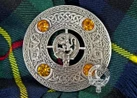 Rampant Lion crest centered on fly plaid brooch.