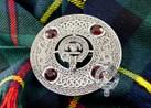 Macleod clan crest centered on fly plaid brooch