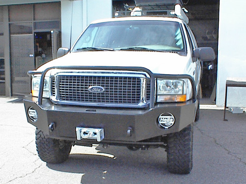 Picture of an Excursion van featuring Aluminess Front Bumper parked on the street.