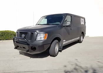 A matte black Nissan NV van with a slimline front winch bumper from Aluminess Products.