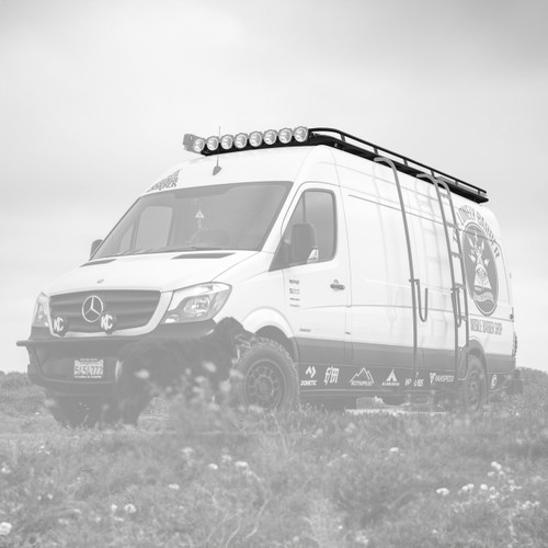 Black and white image highlighting Aluminess Weekender Roof Rack for Sprinter vans.