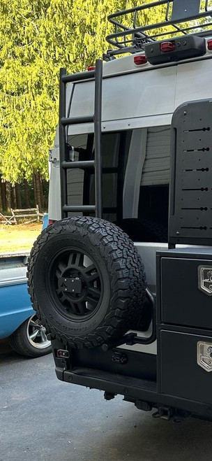 Rear view of a van featuring Aluminess Saved By The Tire Bundle for Dodge RAM Promaster vans.
