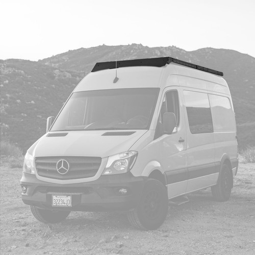 Mercedes Sprinter van parked featuring Aluminess Recon Roof Rack.