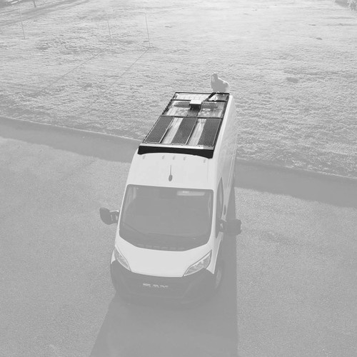Top-down view of a Dodge Promaster van featuring Aluminess Recon Modular Roof Rack.