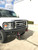 Front winch bumper on a white 2008+ Ford E-Series van.