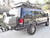 Side view of an black Excursion van on the wild featuring Aluminess Rear Bumper.