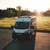 Sunset featuring DIY roof rack atop a white Dodge Promaster van.