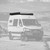 Mercedes Sprinter van is parked in the desert featuring Aluminess Explorer Roof Rack.