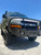 A parked silver truck in a parking lot with an Aluminess Front Bumper - Express 2003+.