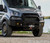 Transit van by water with Front Winch Bumper 2020+, bull bar and brush guards visible.
