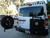 A gloss white Nissan NV van with an off-road rear bumper and accessories from Aluminess Products.