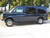 Blue Chevy Express van with all-aluminum nerf bars from Aluminess Products.