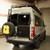 Pearl white Mercedes Sprinter van featuring Aluminess Rear Door Lower Plate parked.