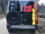 Rear view of a pearl white Mercedes Sprinter van featuring Aluminess Rear Door Storage Space Saver