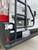 Close-up picture featuring Aluminess Rear Door Ladder on a white Dodge RAM Promaster.