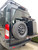 Close-up picture featuring Aluminess Driver Side Rear Door Box/Tire Rack on a Ford Transit van.