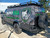 Business logo wrapped Ford E-Series van outfitted with a Weekender Roof Rack from Aluminess Products.