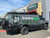 Business logo wrapped Ford E-Series van outfitted with a Weekender Roof Rack from Aluminess Products.