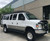 White Ford E-Series van outfitted with a Weekender Roof Rack from Aluminess Products.