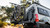 Rear view of a Sprinter van with a mounted bike rack holding multiple bicycles.