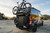 Transit van with Aluminess Bike Rack mounted, holding a bicycle at sunset.