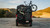 Transit van with Aluminess Bike Rack mounted, holding a bicycle at sunset.