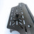 Close-up of the Dash Mount System plate showing textured metal surface.
