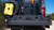 Close-up of the PowerLift Trail Caddy mounting bracket and yellow fuel canister.
