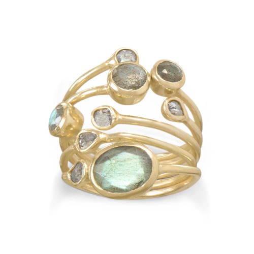 14 karat gold plated sterling silver nonuniform multi split row ring with a stacked cluster of 4mm, 5mm, 4mm, and 7mm x 9mm bezel set faceted labradorite stones and ununiform bezel set polki diamonds. The rows taper together to a 7mm band in the back of the ring. This ring is available in whole sizes 6-10.

.925 Sterling Silver