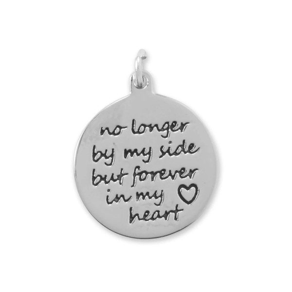 Keep your loved ones close to heart. Rhodium played sterling silver 16.6mm round charm with the phrase "no longer by my side but forever in my heart", alongside a tiny heart outline accent. The back of this item can be engraved for an additional cost.