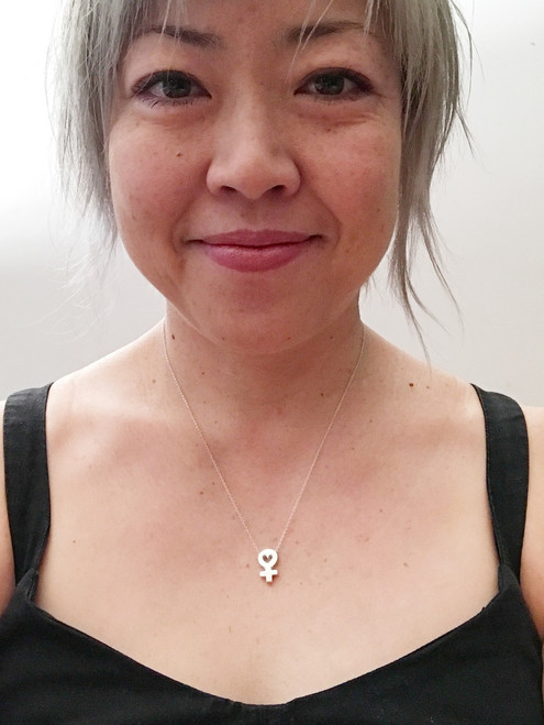 This is the 18" length on me!  It's currently my favorite length for necklaces.  Sometimes I do like to double up on necklaces, in which case, this one is small enough that I like to wear it as my "shorter length necklace" (one size shorter from your bigger/longer necklace).  