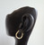 14kt yellow gold notched lever hoops, side view on mannequin