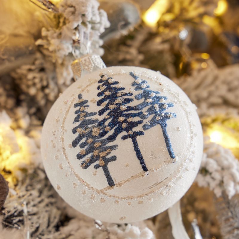 White bauble with blue tree design